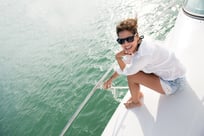 Beautiful woman in a yacht enjoying the summer