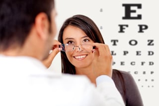 Woman wearing glasses after taking a vision test at the doctor.jpeg